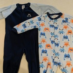 Two monster themed footed onesies for toddlers